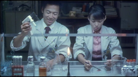 Toshiaki and Asakura are doing some scientific things, with lots of specialist equipment. There is a Bunsen burner in the middle of the frame