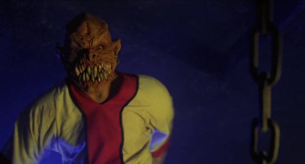 The fictional character of Baraka, looking almost directly into the camera. He is described as being based on the design of Nosferatu, but with more teeth.